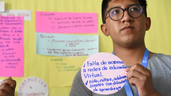 Youth participants at the “Sharing the table” workshop in Porto Alegre, Brazil, presented young people’s concerns in the LWF LAC region. Josue Vera Gutierrez, Bolivian Evangelical Lutheran Church, explains the social challenges in Bolivia. Photo: LWF/Eugenio Albrecht