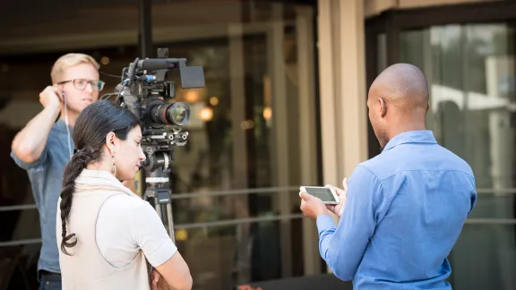 Participants prepare a video interview during the lead-up to the Twelfth Assembly of the Lutheran World Federation. Photo: LWF/Albin Hillert