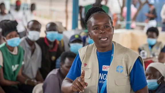 Livelihoods officer Hilda Thuo gives instructions for the distribution of core relief items to refugees at the reception centre of the Kalobeyei refugee settlement near Kakuma refugee camp, Kenya. Photo: LWF/ Albin Hillert