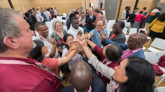 The message of God’s love calls us to go out into the world and to serve all people." In the photo, LWF member church delegates take part in a joint exercise, prior to the start of the Thirteenth Assembly in Kraków, Poland, last September. Photo: LWF/Albin Hillert 