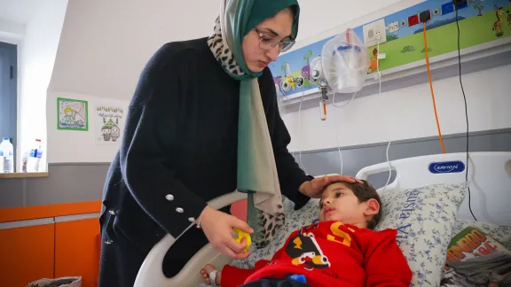 "Ahmed” and his mother. The family has been divided by the war, the young woman fears for the lives of her family. Photo: LWF/ Atta Jabr