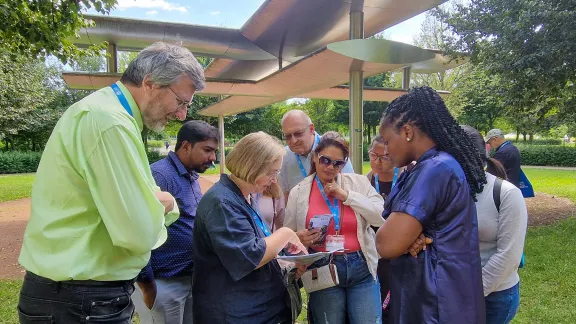 Searching for the trees planted by church representatives across the communion in Luthergarten, Wittenberg. Photo: LWF/A. Weyermüller