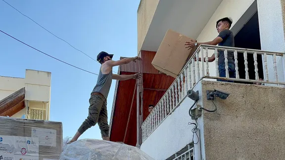 Personnel at the Ahli Arab Hospital off-loading the LWF medical supplies from a delivery truck. Photo: LWF Jordan