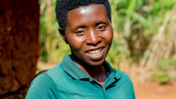 Euphigenie Ntezimana in front of her home. Photo: LWF/L. Gillabert