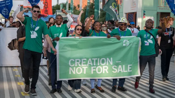 Delegates of the Lutheran World Federation to COP28 pictured as civil Society organizations gather for a Global March for Climate Justice at the United Nations climate summit COP28, walking simultaneously in solidarity with a call for Ceasefire Now in Israel and Palestine. Photo: LWF/Albin Hillert