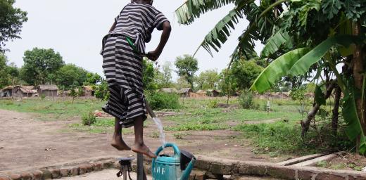  A young boy pumps water from well and into his watering can in Chad.  Photo: LWF/C. KÃ¤stner