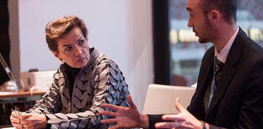 Martin Kopp (right), LWF delegate to the UN Climate Conference (COP19), speaks with Christina Figueres, director of UN Framework Convention on Climate Change. Photo: LWF/ Sean Hawkey