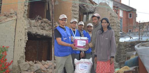  LWF providing relief materials (ready-to-eat food) to a family whose house was destroyed. Credit: LWF Nepal
