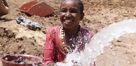 A splash of fresh water from a newly constructed borehole at Teferi Ber refugee camp, Ethiopia. Â© LWF/R. Bueno De Faria