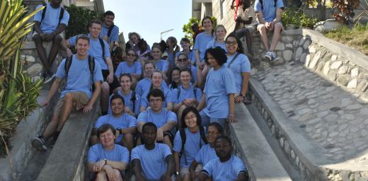 Students from Luther College in the United States take in sights and stories at LWF's model village in Gressier, Haiti.Photo: LWF/Helene Branco