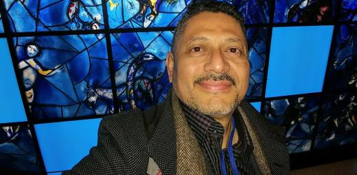 The people that walked in darkness have seen a great light: Larry Madrigal stands in front of the stained glass mural that inspired his mother at the 1994 CSW. Photo: L Madrigal