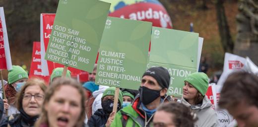 Representatives from the LWF joined a march through Glasgow city center, calling for climate justice and for world leaders to address the climate emergency at COP26. Photo: LWF/Albin Hillert