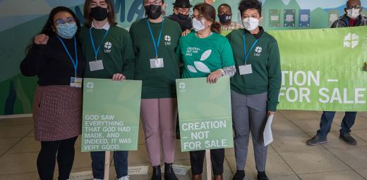 Delegates from the Lutheran World Federation and ACT Alliance standing together for the message of âCreation - Not for Saleâ during COP26 in Glasgow. Photo: LWF/Albin Hillert