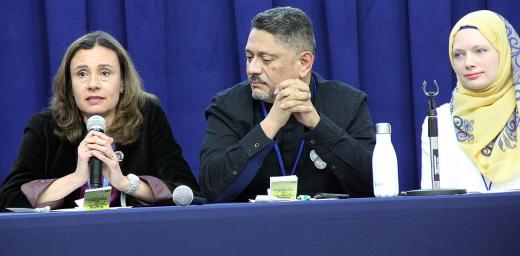 MarÃ­a Cristina RendÃ³n, program assistant in LWF Women in Church and Society speaks at the panel discussion. With her is LWF delegate Larry Madrigal Rajo, and Iman Sandra Pertek (right).
