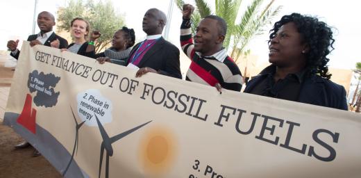 Campaign stunt symbolizing divestment from fossil fuels and support of renewable energies at COP 22 in Marrakech, Morocco in December 2016.  Photo by LWF/Ryan Roderick Beiler