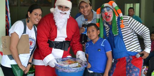 AIDS work in the Nicaraguan Lutheran Church of Faith and Hope prioritizes children. Rev. Soliette LÃ³pez, left, Alexander GarcÃ­a, Kevin Mena and Sergio Rios take part in a children's Christmas party for children often  left out because of discrimination, in the western city of Masaya, near the capital Managua. Photo: Daniela Cruz