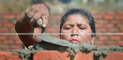 Bhagwati Tamang lays bricks in Jogimara village in central Nepal after the devastating earthquake of April 2015. Following the disaster, the LWF worked jointly with Islamic Relief Worldwide and other partners to provide shelter in remote villages where thousands lost homes and livelihoods. Photo: Paul Jeffrey/ACT