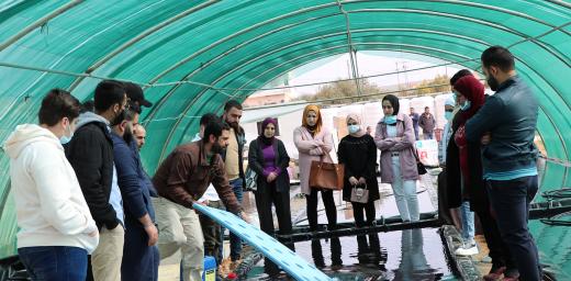 LWF Jordan staff, refugees and host community members take part in a training on hydroponics farming. The system uses 90 percent less water compared to conventional farming, and it is powered by photovoltaic panels, which also reduce fossil fuel energy consumption. Photo: LWF Jordan/Daham Al-Hamad