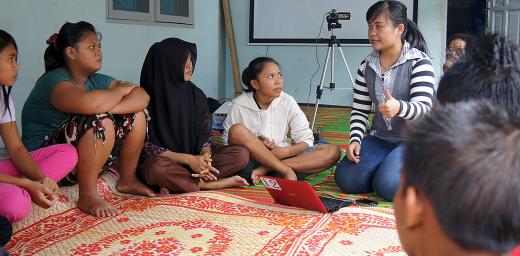 Elisabeth Purba (center) talking about HIV and AIDS at a youth workshop organized by the Indonesia LWF National Committee in Desa Bulu Cina, Sumatra. New global development goals will work to lower HIV and AIDS transmission rates. Photo: LWF/C. KÃ¤stner