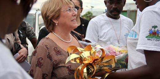 Michelle Bachelet receives flowers during a visit to Haiti in 2012 during her tenure as UN Women executive director. Photo: UN Women (CC-BY-NC-SA)