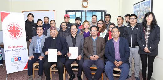 LWF representatives and Caritas Nepal team after signing the MoU in the Caritas Nepal office. Photo: LWF