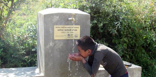 A child quenches his thirst from a water tap installed by LWF and HURADEC in Pattitar, Nepal. Photo: LWF/ M. Timsina