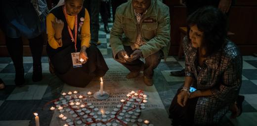 Participants light candles during a July 19 interfaith prayer service, held at the Roman Catholic Emmanuel Cathedral in Durban, South Africa, during the 2016 International AIDS Conference