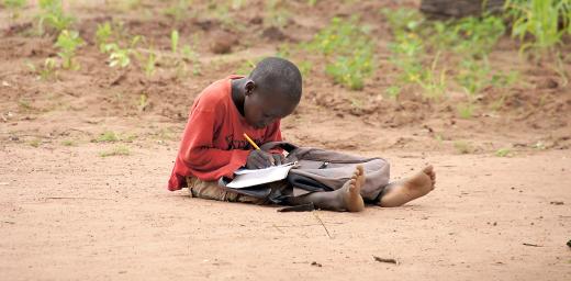 A young boy doing his homework in Yida refugee camp, South Sudan. Photo: LWF/ M. Hyden