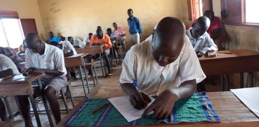 Primary school students sit their final examination at Napata school in Ajoung Thok refugee camp, South Sudan. Photo: LWF South Sudan