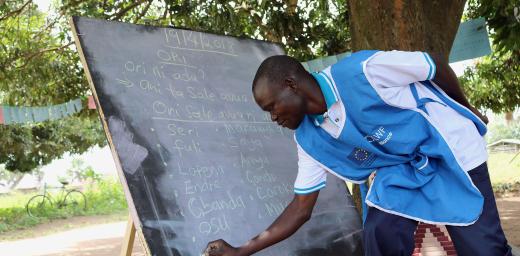 Paul Sunday Odriga teaches students at at Duba Functional Adult Learning Centre in Adjumani district. Photos: LCCN