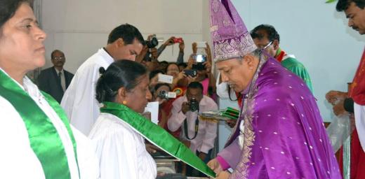 Bishop Emmanuel Panchoo declares Rev. Elizabeth Prasad an ordained pastor of the Madhya Pradesh Lutheran church, one of the first women to be ordained in the church. In the foreground, Rev. L.K. Khakha, another of the four women to be ordained by the church for the first time. Photo: ELC-MP/Nima David
