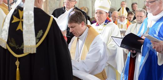 LWF President Bishop Dr Munib A. Younan and other church leaders during the consecration of Estonian Lutheran Archbishop Urmas Viilma (kneeling) at St Maryâs Cathedral in Tallinn. Photo: Erik Peinar