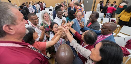 The message of God’s love calls us to go out into the world and to serve all people." In the photo, LWF member church delegates take part in a joint exercise, prior to the start of the Thirteenth Assembly in Kraków, Poland, last September. Photo: LWF/Albin Hillert 