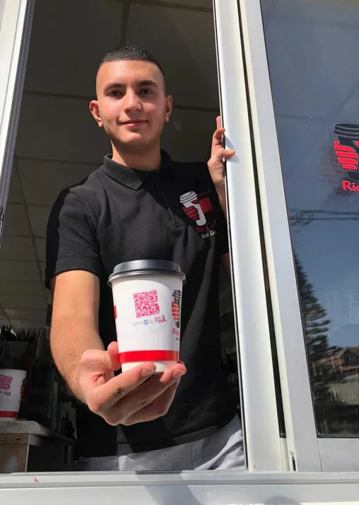 Rio Café, a popular coffee chain in Ramallah, is selling their brew in cups with a message on breast cancer this month. Photo: LWF/AVH