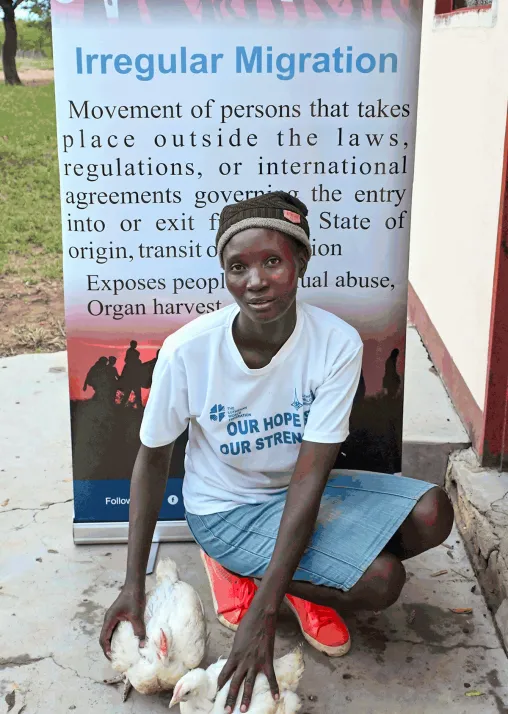 Mildred Nkala, a talented dress maker, runs her own poultry business, with support from Symbols of Hope Zimbabwe. Photo: SoH/LDS